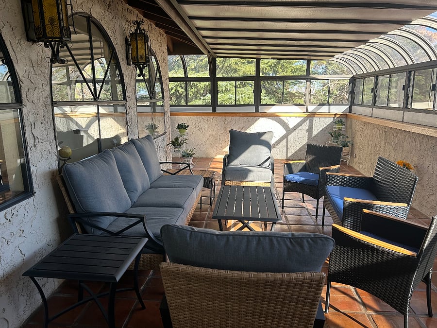 Upstairs solarium with small refrigerator and air conditioner during hot seasons. Entry from master bedroom and bedroom.#3.