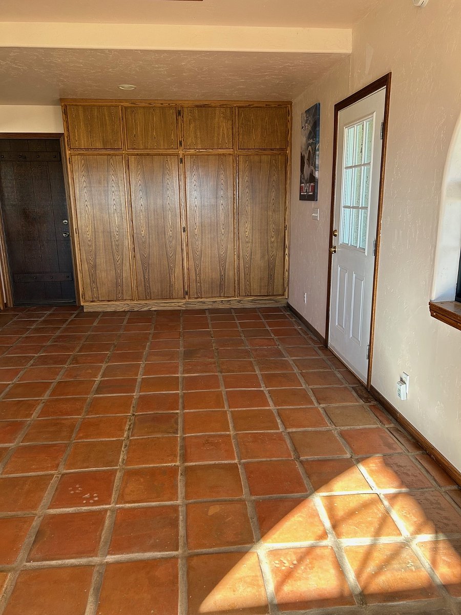 Enclosed downstairs patio with outside door and entrance to the garage.  Lots of cabinet space 