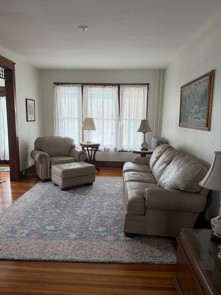 Large, bright, comfy living room.