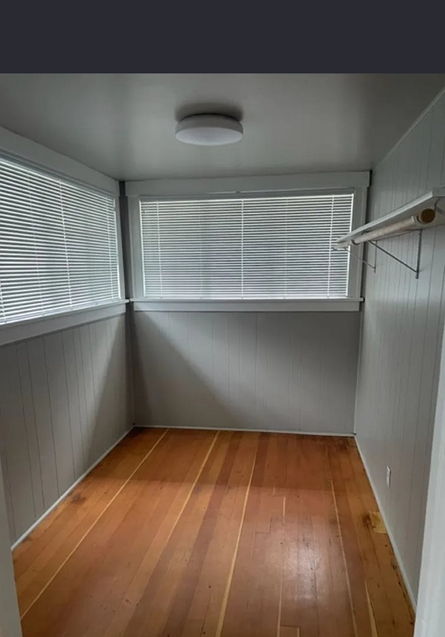 Primary walk in closet, before we installed an extra rod/ shelf
