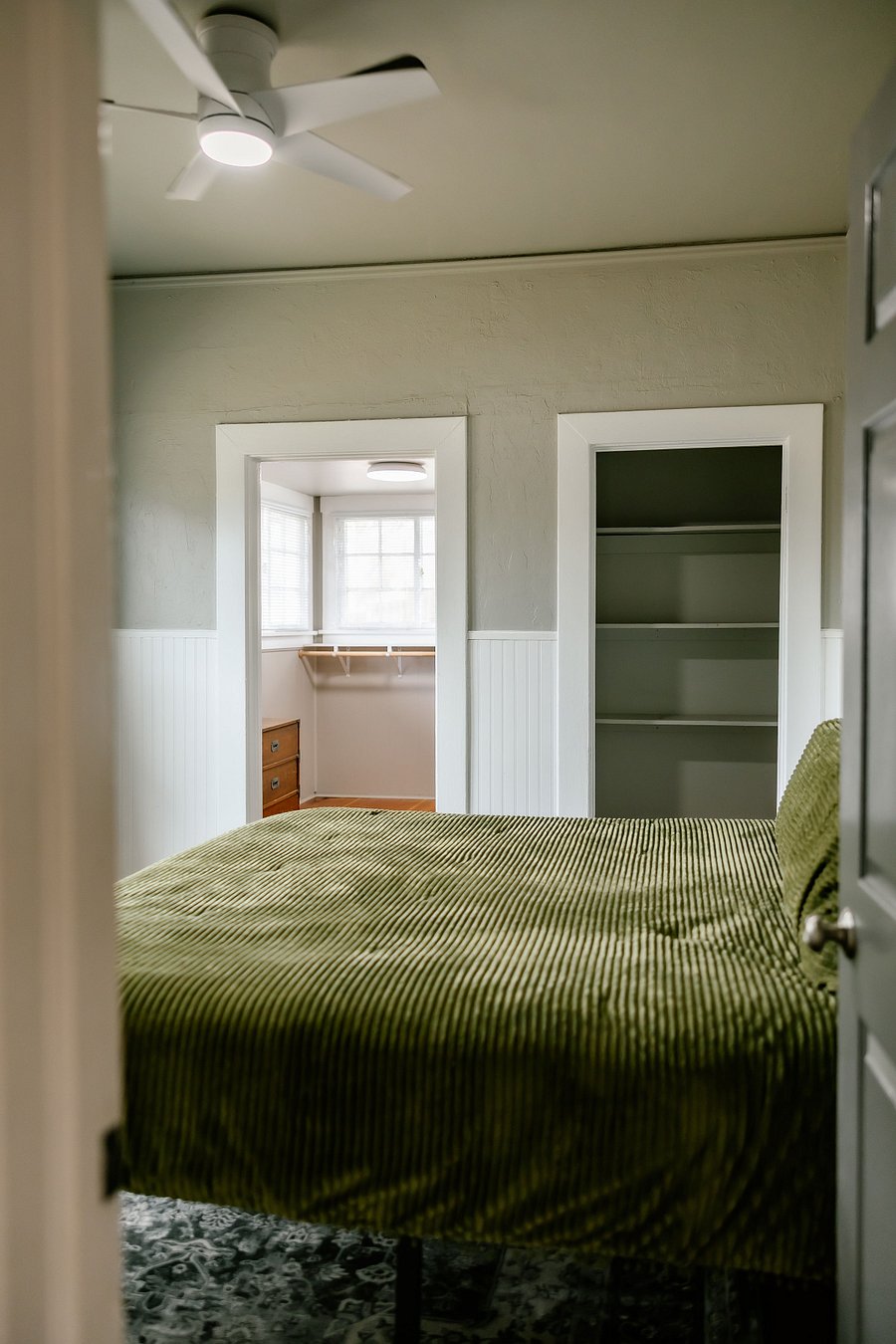 Primary bedroom with king bed, reach in closet and walk in closet