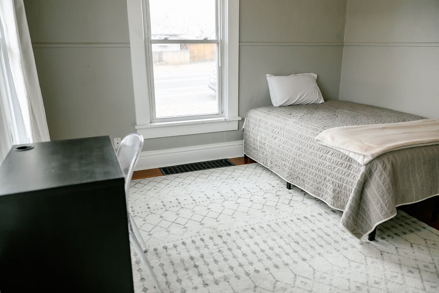 Second bedroom with double bed, small reach in closet and desk