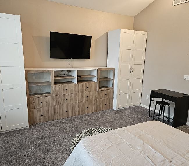Lots of built-in storage.  4-bin clothes hamper in right-hand cabinet.  55-inch Roku Smart TV with lots of paid streaming channels provided.