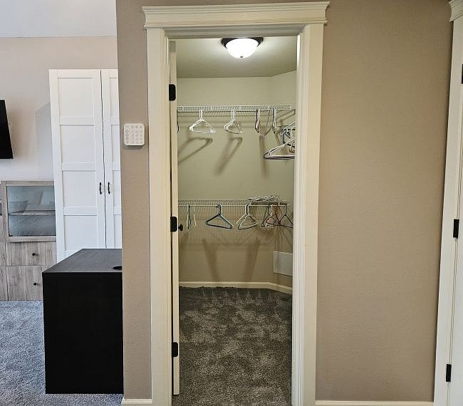 The master bedroom has a large walk-in closet (separate from the additional walk-in closet in the master bathroom.)  A 6-cubby shelf can be added in the closet if desired (for shoe storage, etc...)