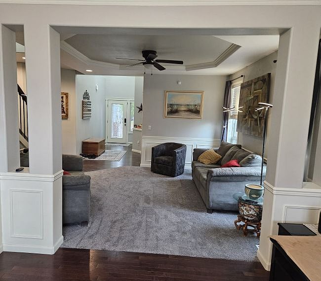 Parlor and entry way viewed from craft room.  The parlor has a ceiling fan to enhance air circulation.