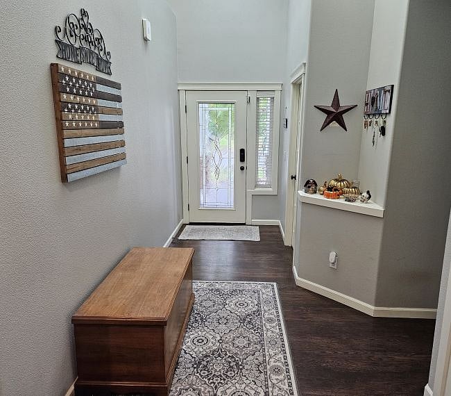Interior view of front entry to house.  The front door has a Schlage keyless electronic lock.
