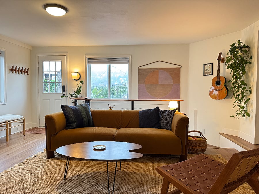 Living Room, complete with gas fireplace, tv, couch, storage, games