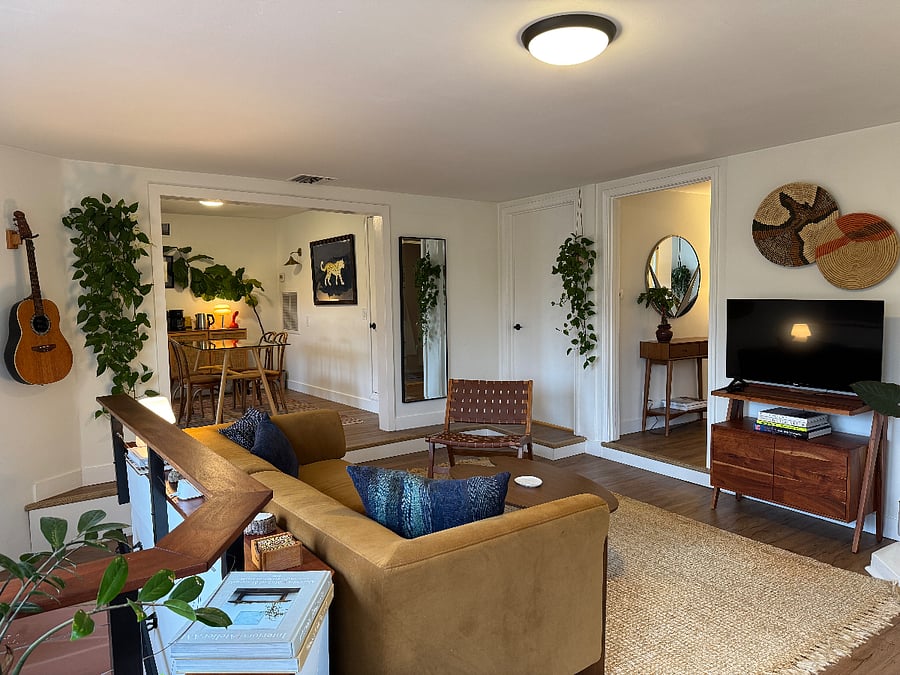 Living Room, complete with gas fireplace, tv, couch, storage, games