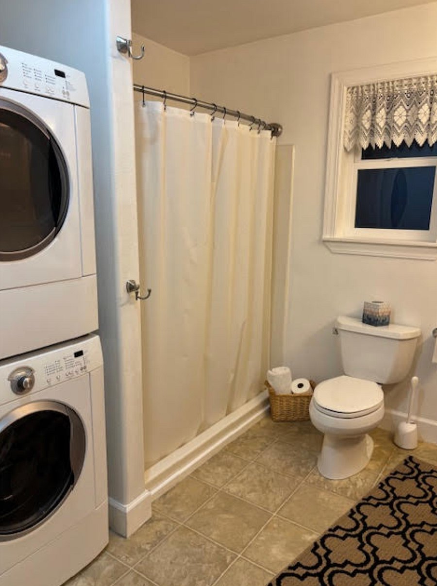 Bathroom with full washer and dryer.