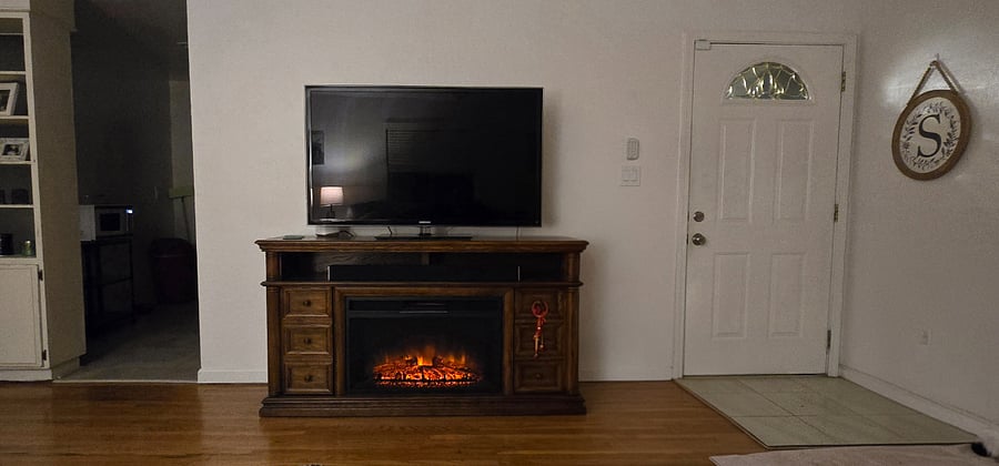Shared smart TV, electric fireplace and entrance. 