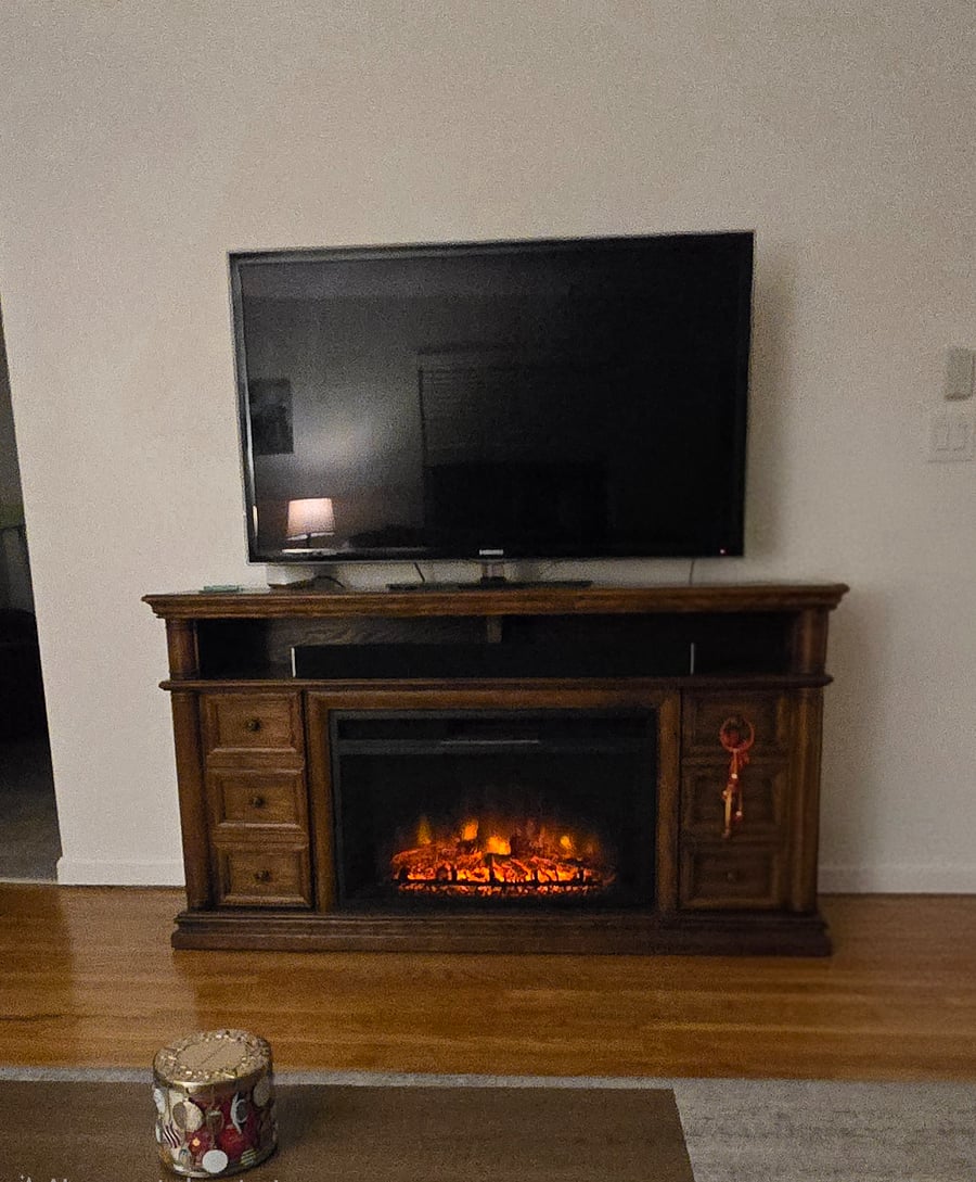 Shared smart TV and electric fireplace. 