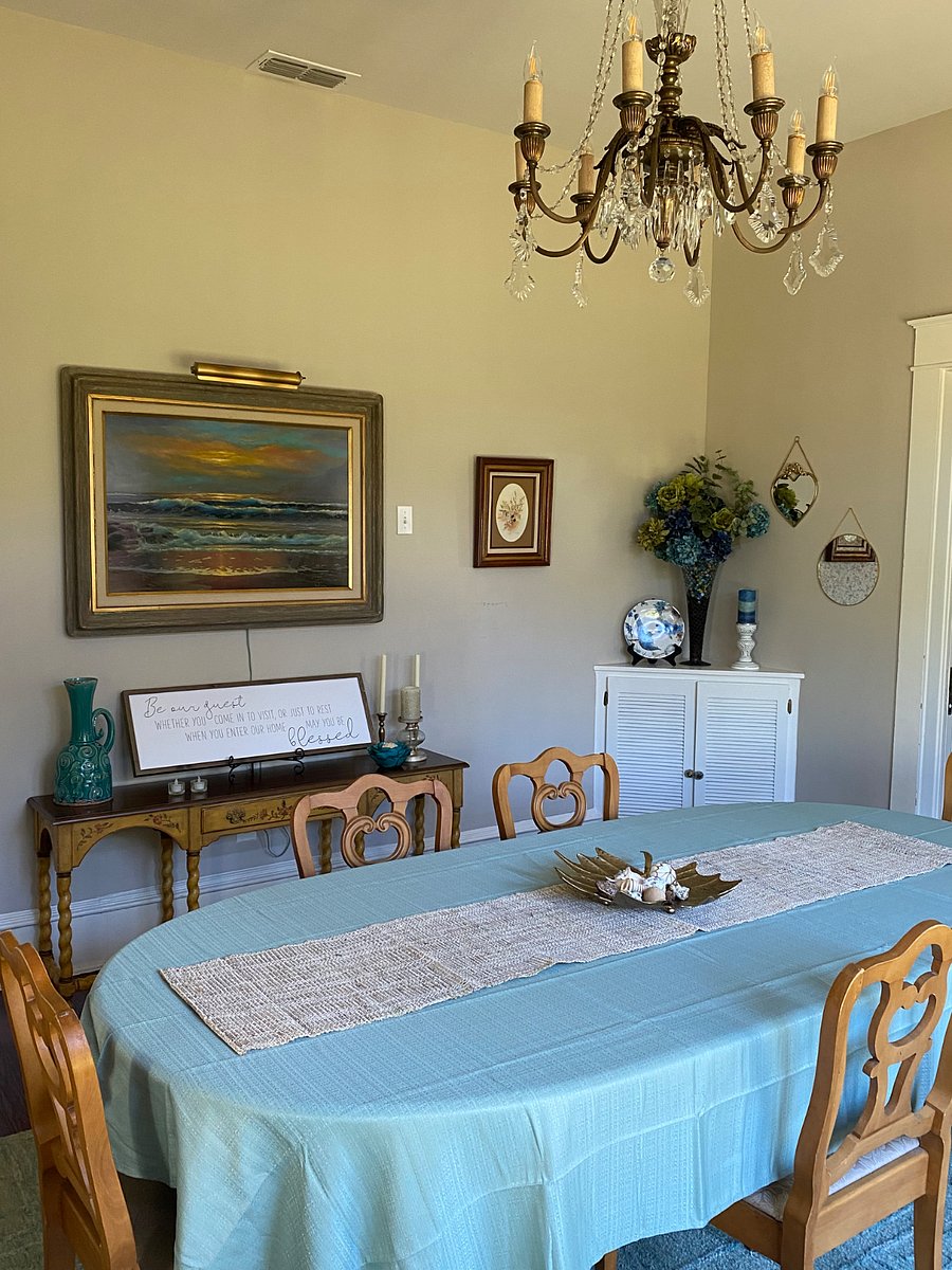 Beautiful bright dining room that looks our into the backyard