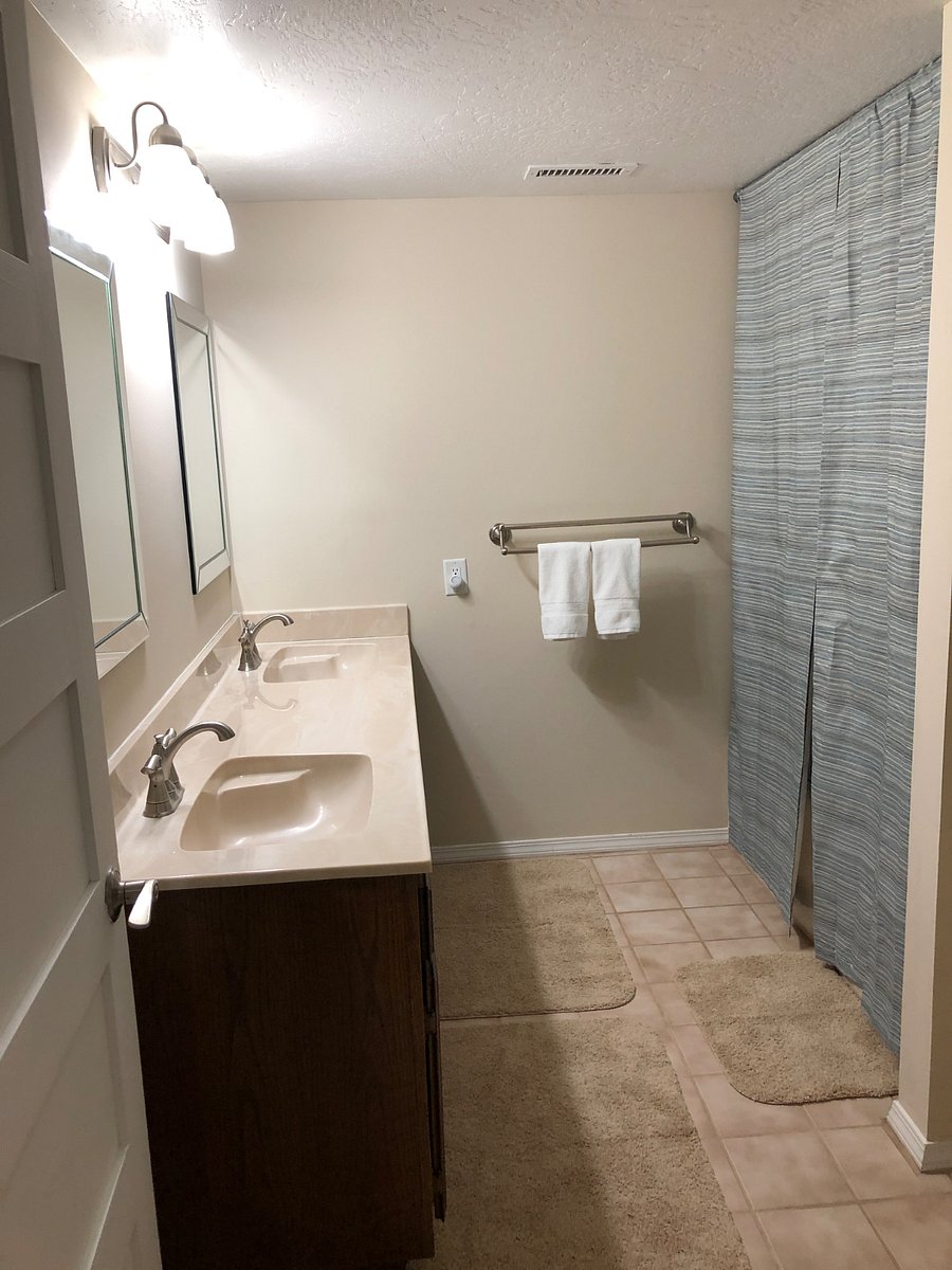 Private bathroom with double sinks.