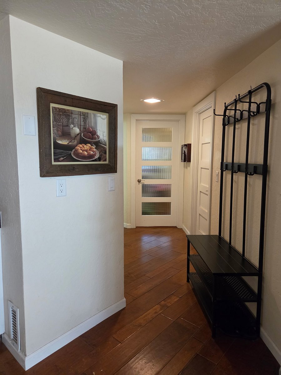 Door to private laundry room (windows).