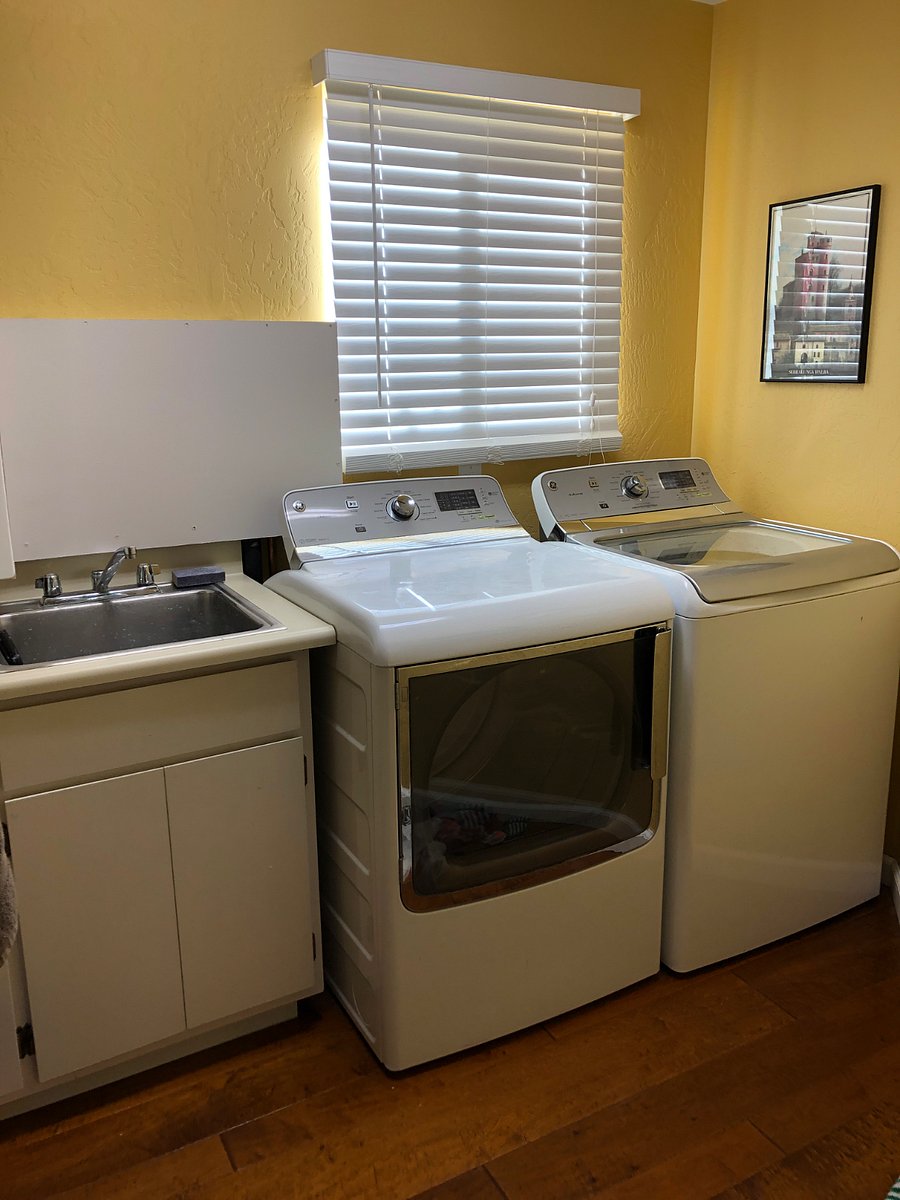 Laundry with spacious utility sink.