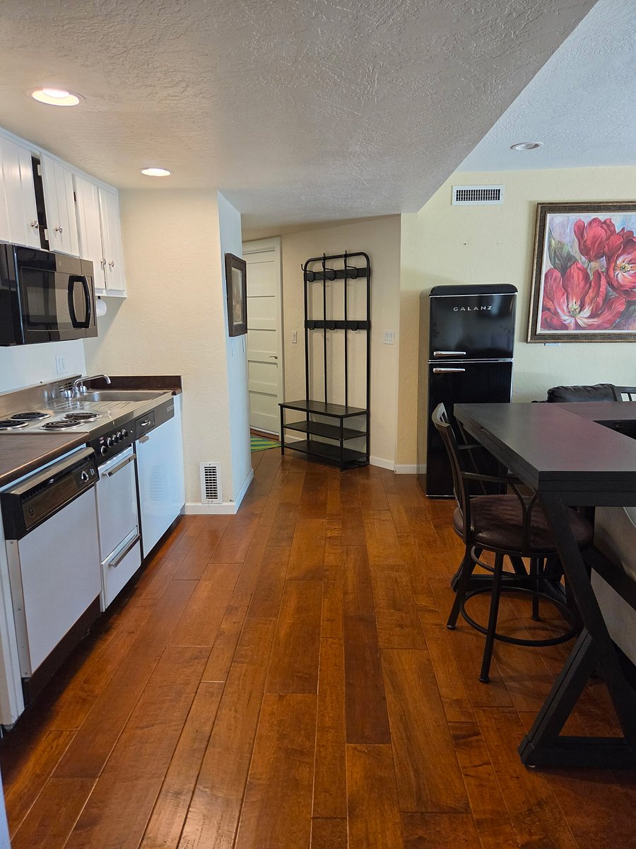 Open concept space reflecting the hall to the private laundry room.