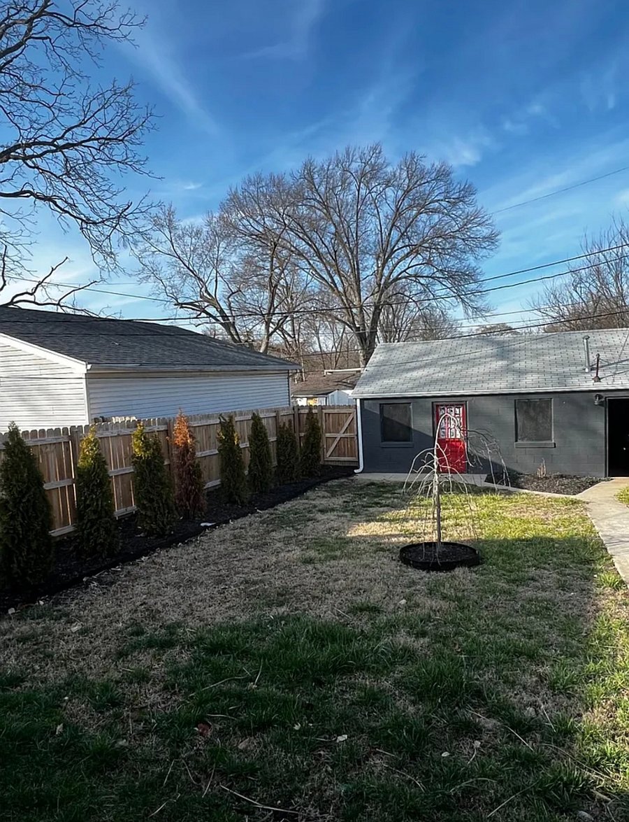 Fenced backyard grey for pets & kids