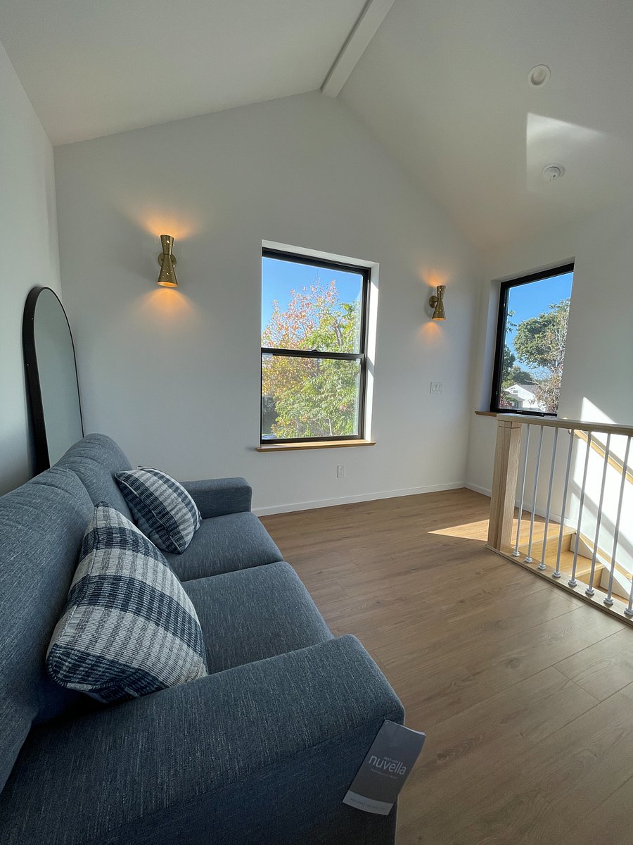 Brand new very comfortable loveseat on 2nd floor with view of tree lined street