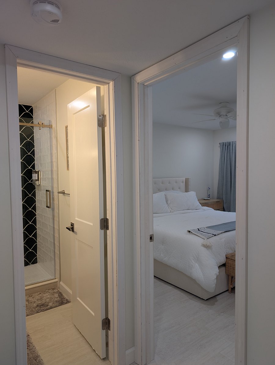 View into the primary bedroom from hallway.