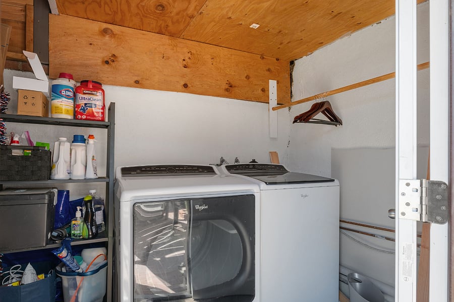 Laundry room is underneath the stairs