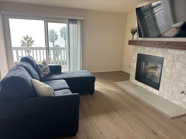 Family room with gas log fireplace and Smart TV