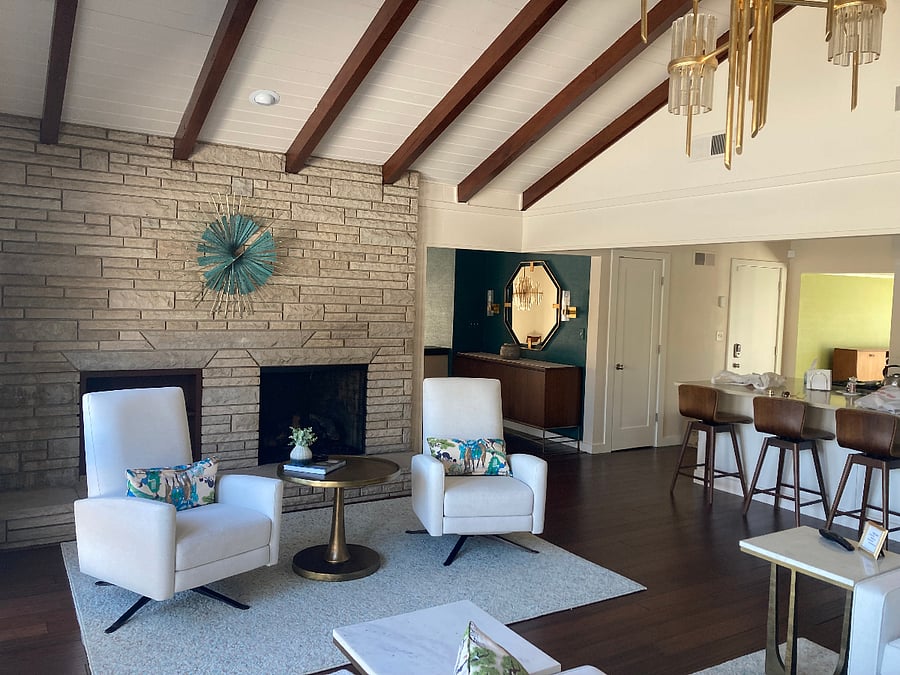 Living room with fireplace that features a convenient gas log.