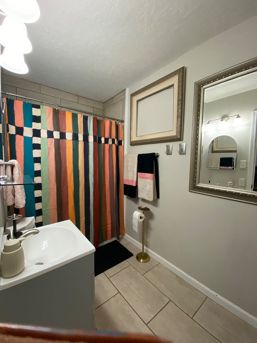 Master bath with full-size fluffy towels and extras.