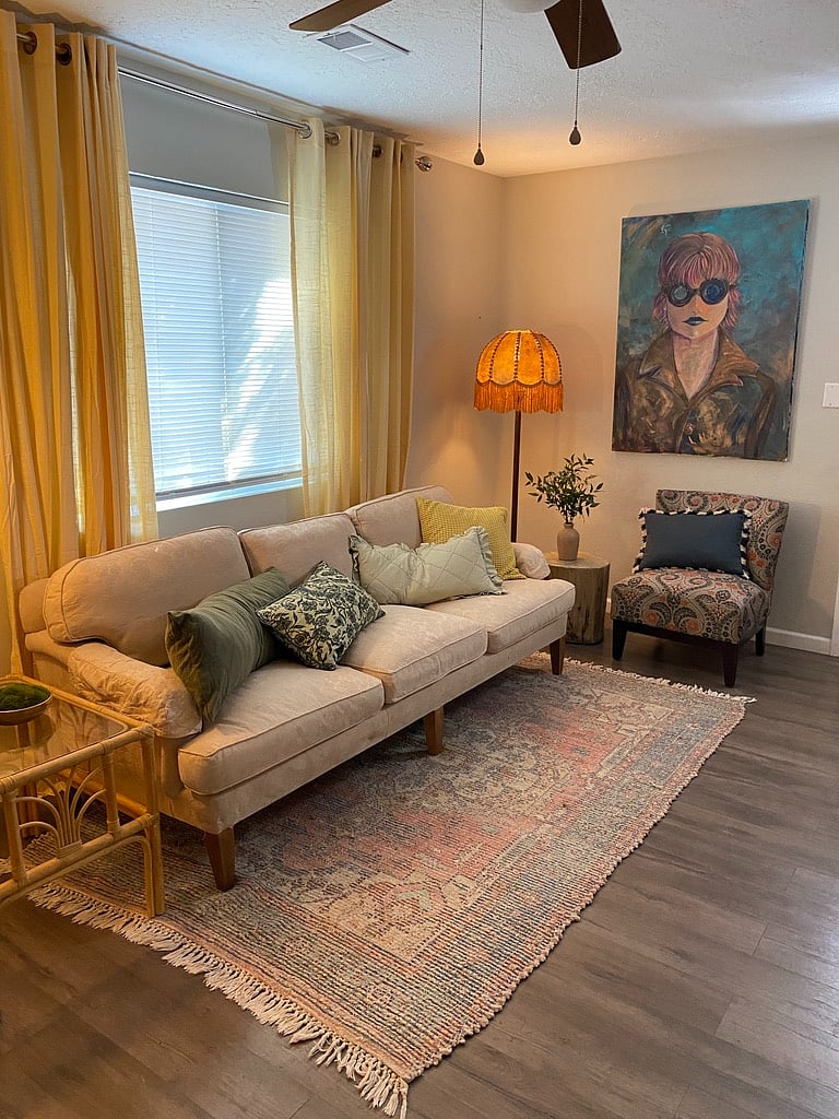 Cozy couch to sit and relax with your favorite shows on the smart t.v.