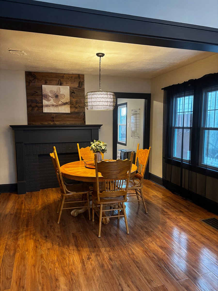 Expandable table with additional leaf and chairs in the basement
