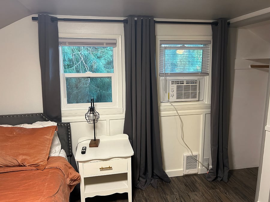 Window AC installed during summer, black out curtains. 