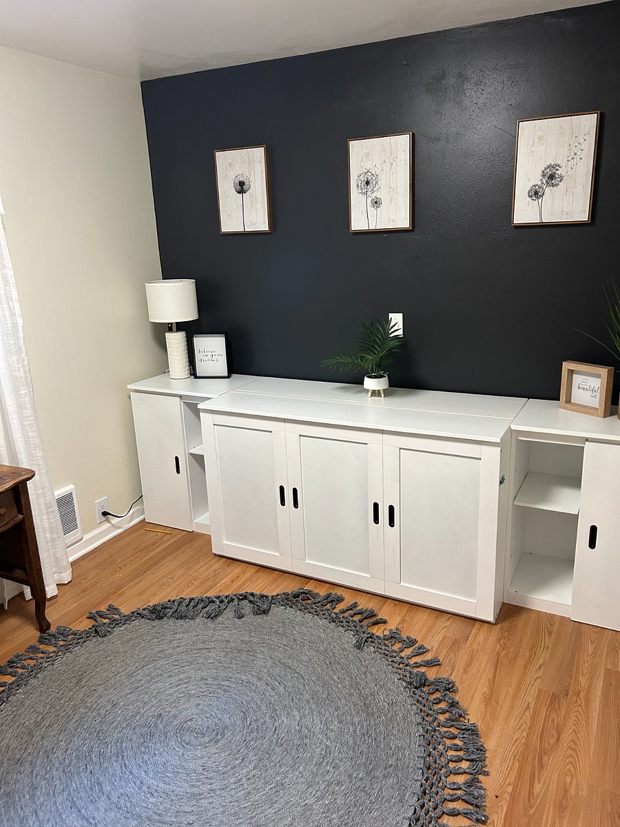 Entry room with bench, small desk and murphy bed.