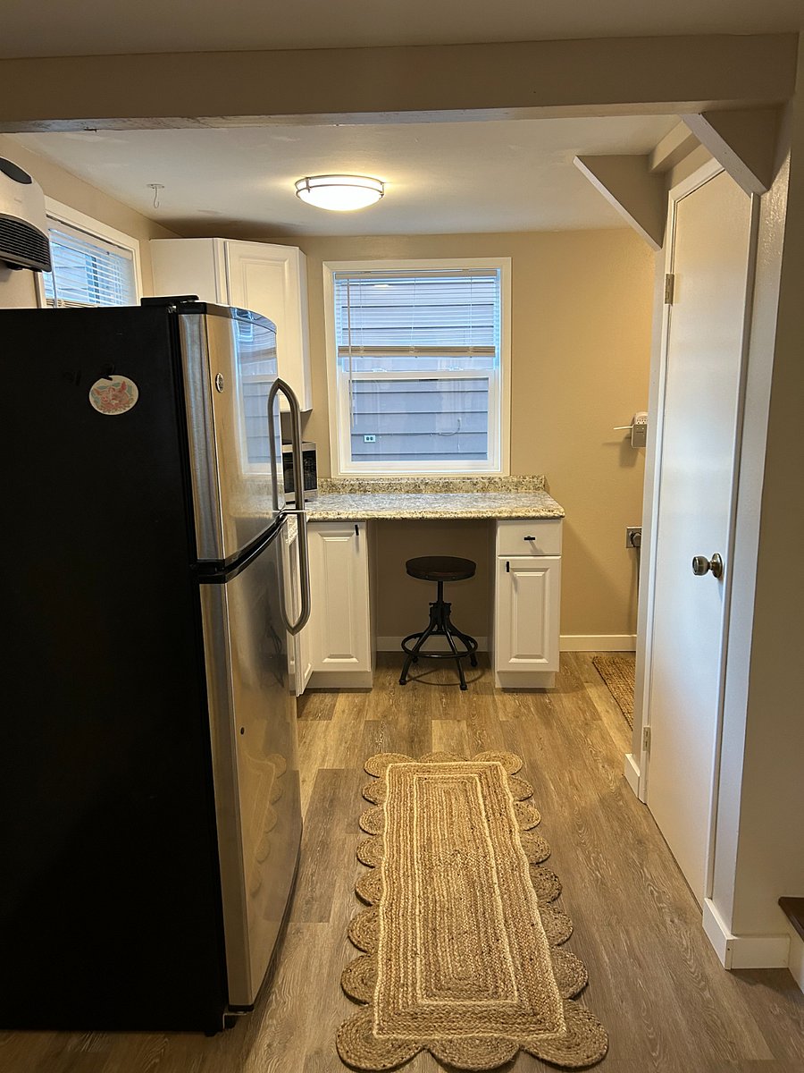 Fridge, counters with 2 stools