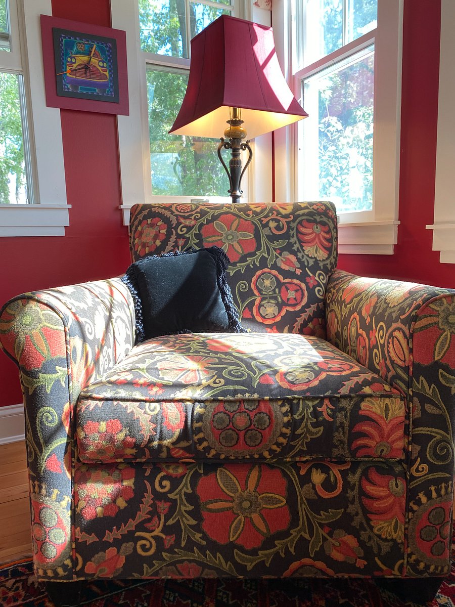 Sunroom/Office with a great ready chair.