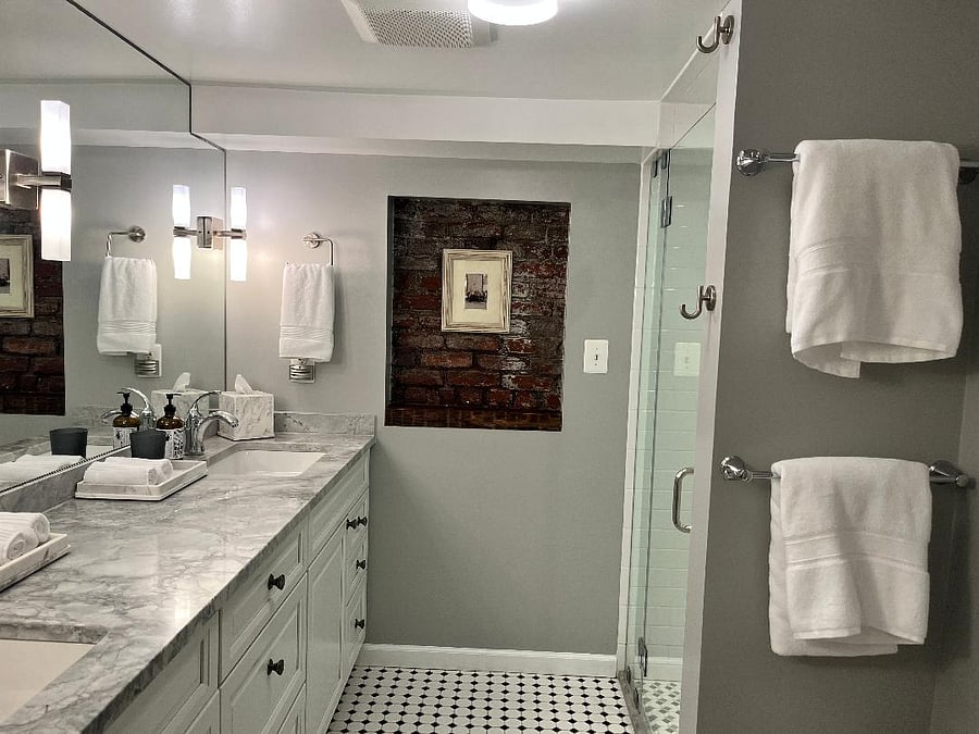 Large bathroom with double vanity and walk-in shower