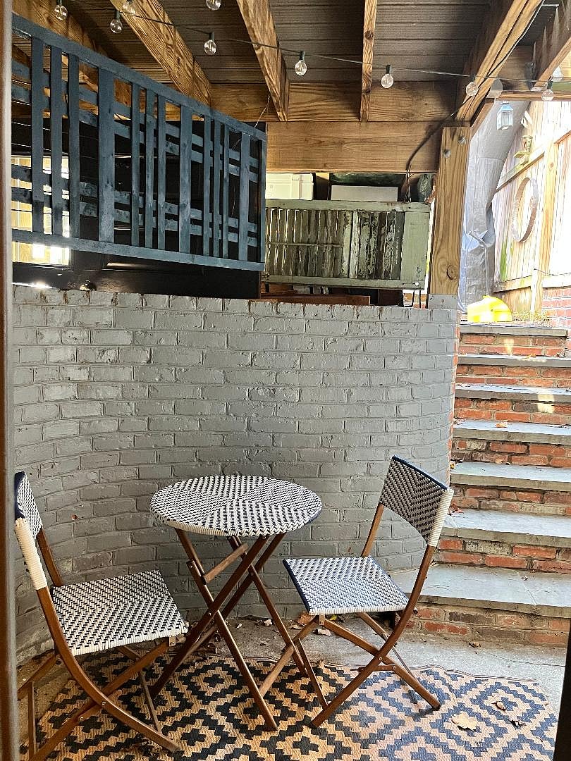 Quaint patio with bistro table and chairs
