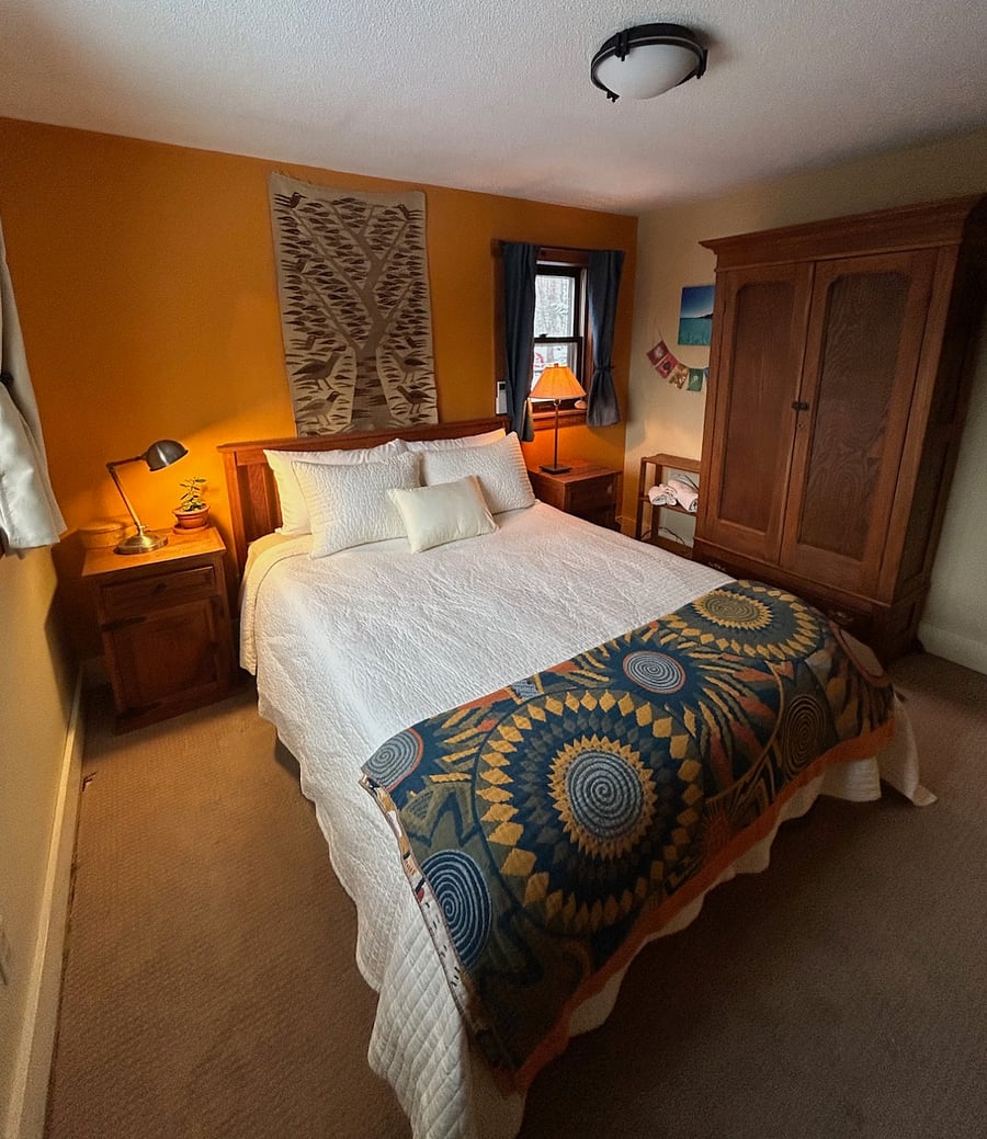 Another view of the bedroom with 1 queen bed.