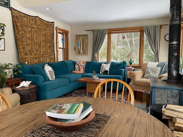 The dining table seats four adults comfortably, and up to five.