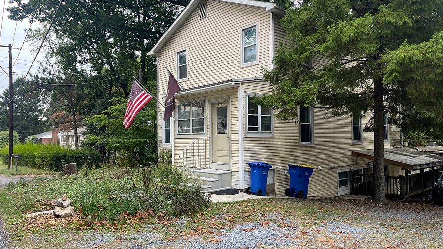 The front of the house. Covered walkway is to the right of the picture. 