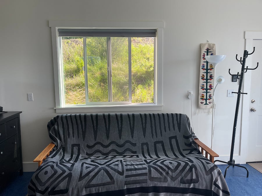 Comfy futon with mattress topper for occasional guests