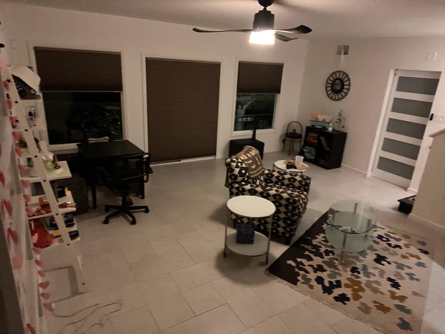 view of living room from bedrooms/bathroom hallway, furnished