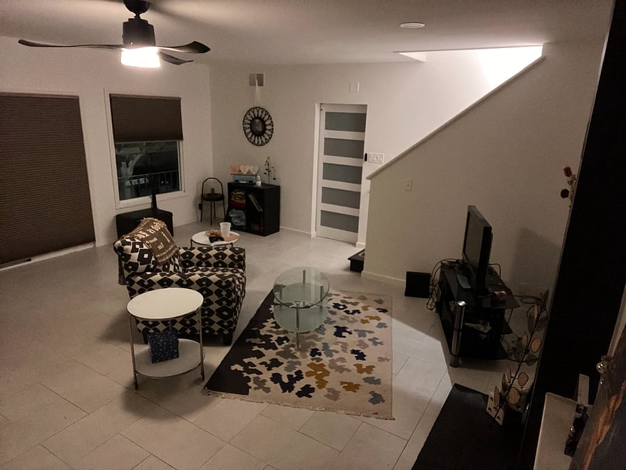 view of living room from bedrooms/bathroom hallway, furnished.