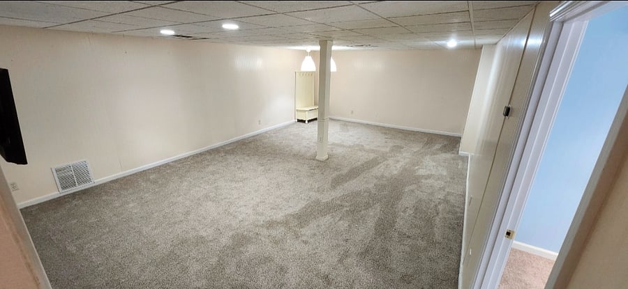Private living area featuring a 50" TV. and its own thermostat for personalized temperature control.