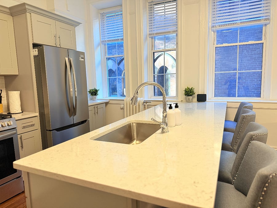 modern kitchen with a large island and bar seating