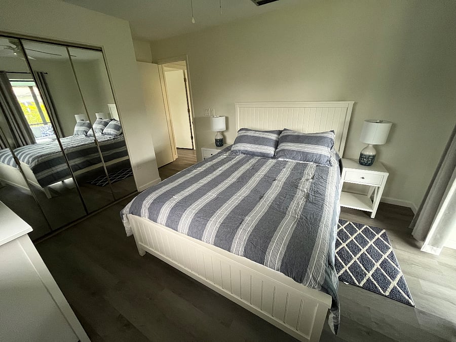 Queen Bedroom includes desk with computer screen and keyboard
