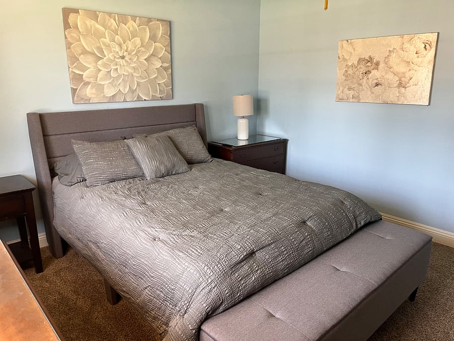 Corner bedroom, large room at the end of the hallway and next to the bathroom.
