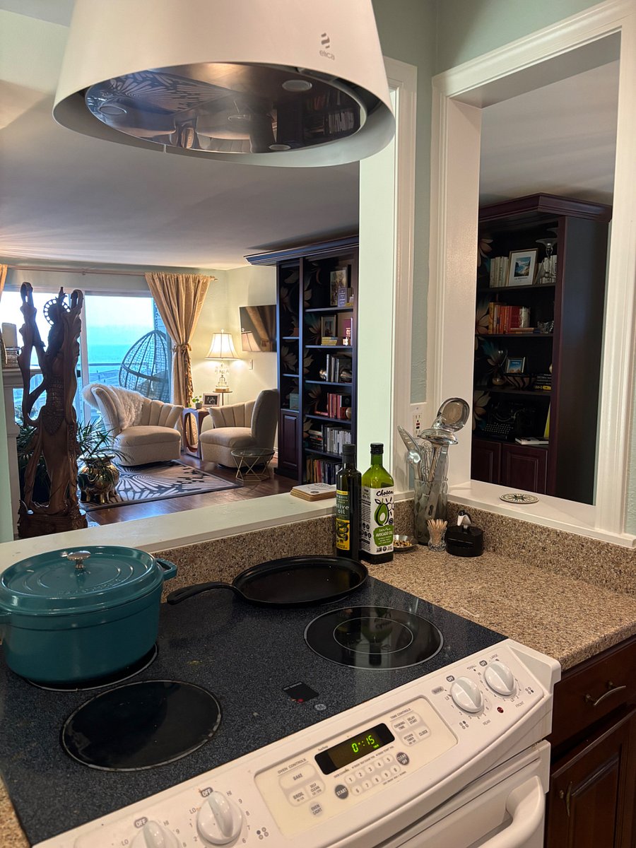 Open kitchen so you can see outside or chat with friends while you cook