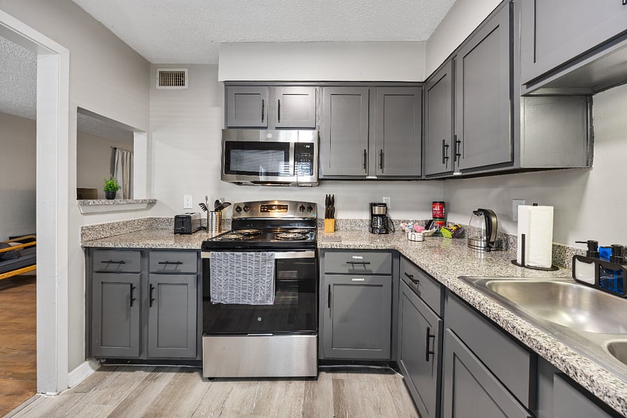 Full kitchen with appliances, pans, silverware, etc.