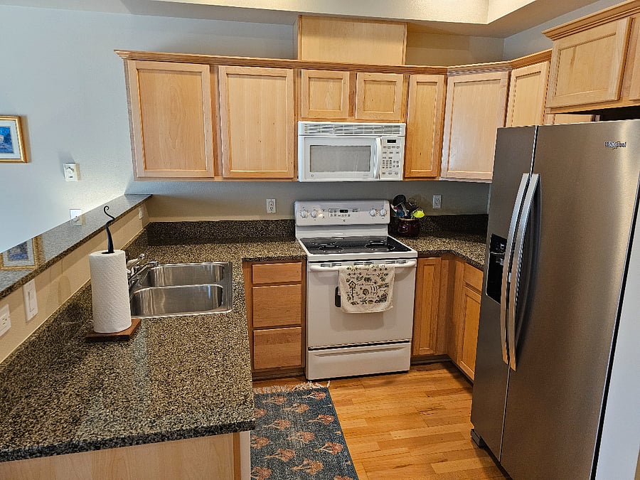 Granite countertops, microwave, new refrigerator, fully provisioned kitchen.