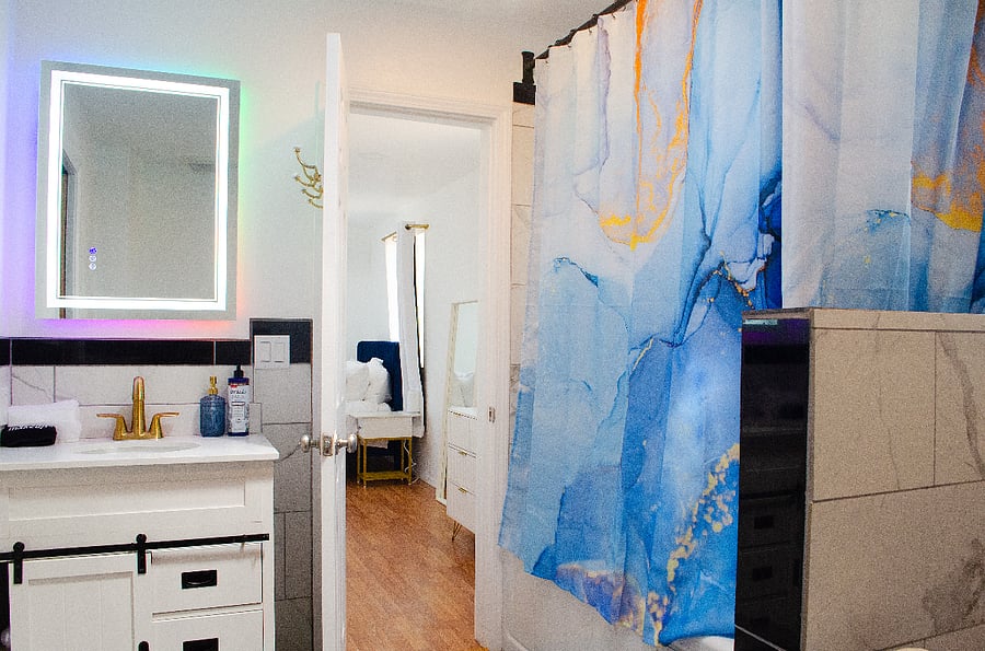 upstairs full bathroom with whirlpool tub and LED mirror