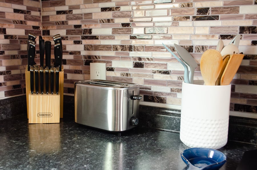 Full kitchen with knives, utensils, and toaster